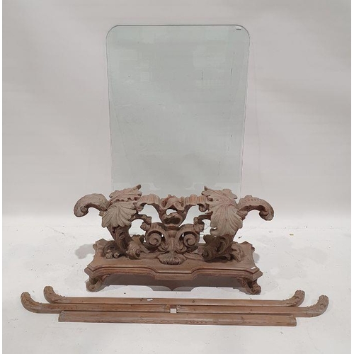 1160 - Coffee table, the rectangular glass top with rounded corners, on heavily carved and moulded base