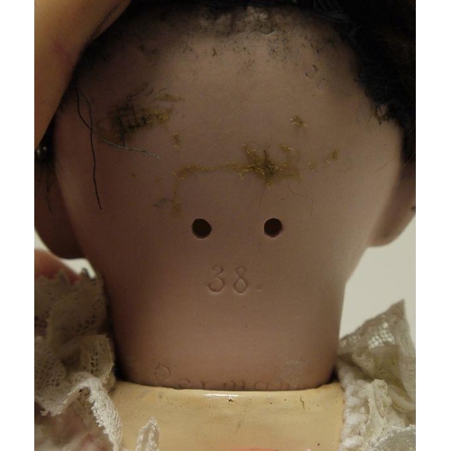 261 - A bisque head baby doll, with composition body, closing eyes and open mouth, marked to back of head ... 