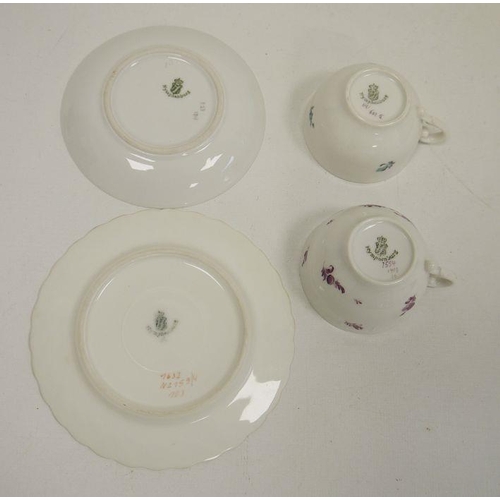 40 - Seven assorted Nymphenburg cabinet teacups and saucers, each with foliate decoration, and one furthe... 