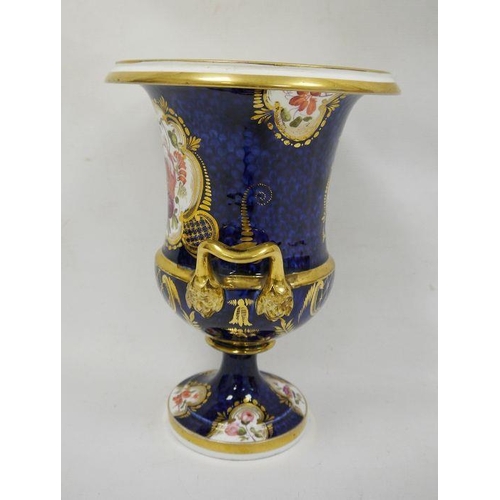 43 - Large Coalport-style two-handled campana vase with gilded decoration over a blue ground, floral pane... 