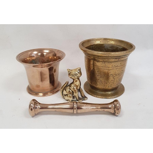 103 - Brass mortar, 13cm high, a copper pestle and mortar and a brass cat ornament (4)