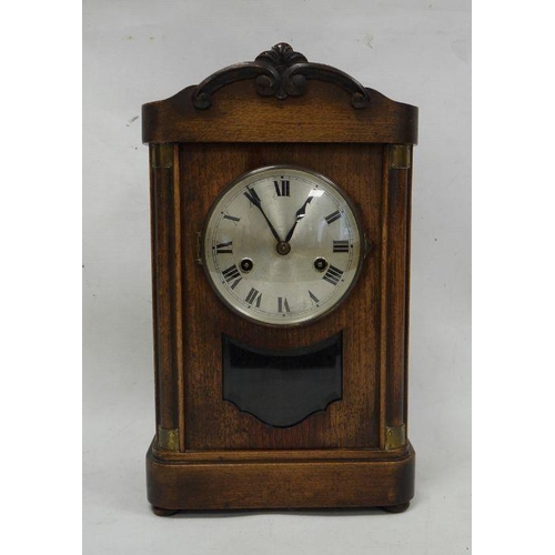 1074 - Early 20th century mahogany bracket clock with Roman numerals to the steel dial, on plinth base