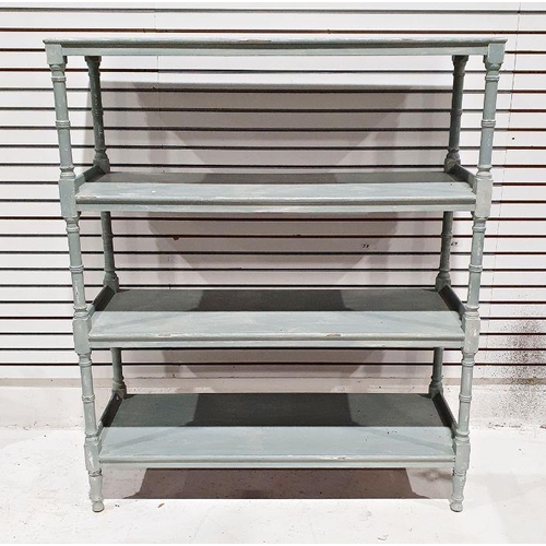 1100A - 20th century painted in the Shabby Chic taste four-tier shelving unit, the tiers united by turned an... 