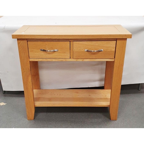 1102B - 20th century oak hall table, the rectangular top above two drawers over shelved undertier, 85cm x 77... 