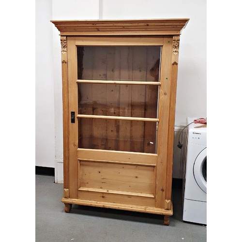 1112A - Vintage pine cabinet, the moulded cornice above glazed door, on shaped supports