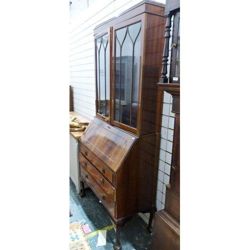 1119 - 20th century mahogany bureau bookcase, the astragal-glazed doors above a base of three drawers, on c... 