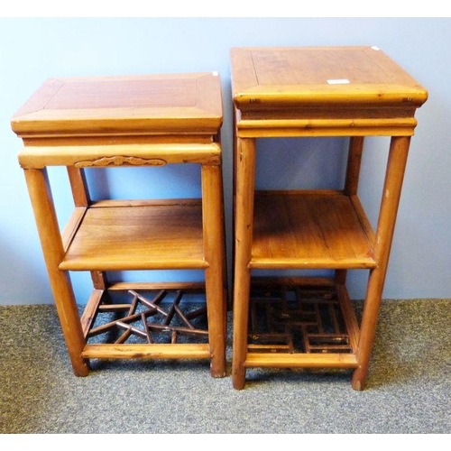 1125 - Two Eastern-style three-tier side tables (2)