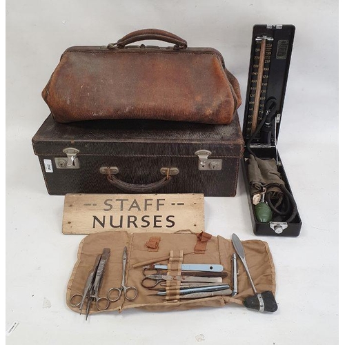 114 - Vintage doctor's leather suitcase with fitted interior and medical accessories, a leather doctor's G... 