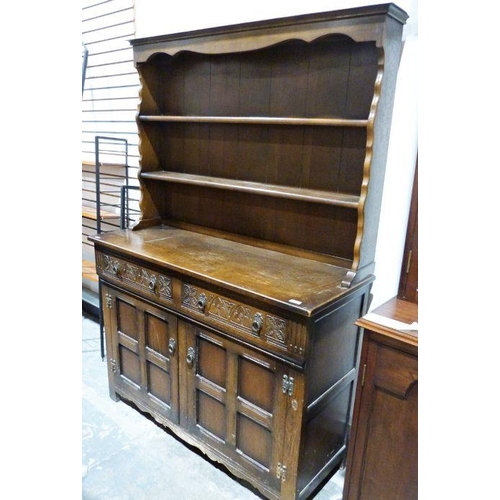 1150 - 20th century dresser, the open shelves above a base of two drawers, two cupboard doors, on stile sup... 