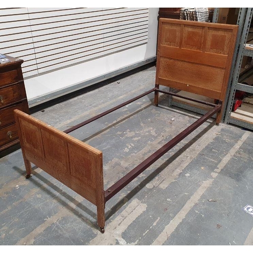 1157 - Pair of early 20th century oak single beds by Heals, the quarter-cut oak headboards with ivorine cir... 