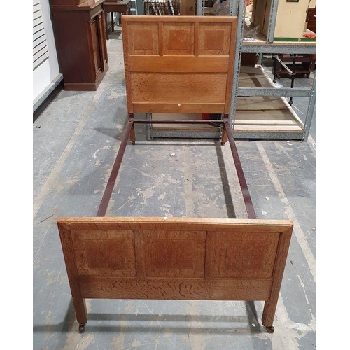 1157 - Pair of early 20th century oak single beds by Heals, the quarter-cut oak headboards with ivorine cir... 