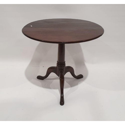 1226 - 19th century oak circular tilt-top table on turned supports to tripod ogee feet