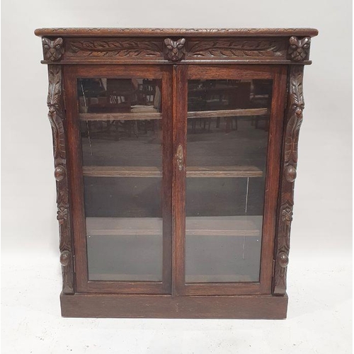 1227 - 20th century carved oak glazed bookcase on plinth base