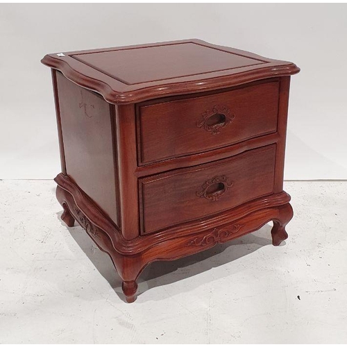 1259 - 20th century Eastern serpentine-fronted bedside chest of two drawers, on squat cabriole legs