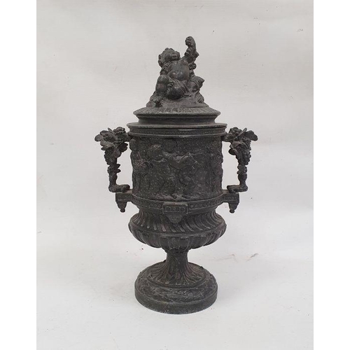 126 - Cast metal two-handled urn decorated with a continuous scene of cherubs in a Bacchanalian feast, the... 