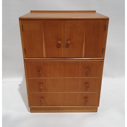 1305 - Mid century modern Meredew oak cupboard with two cupboard doors above three drawers, on plinth base,... 