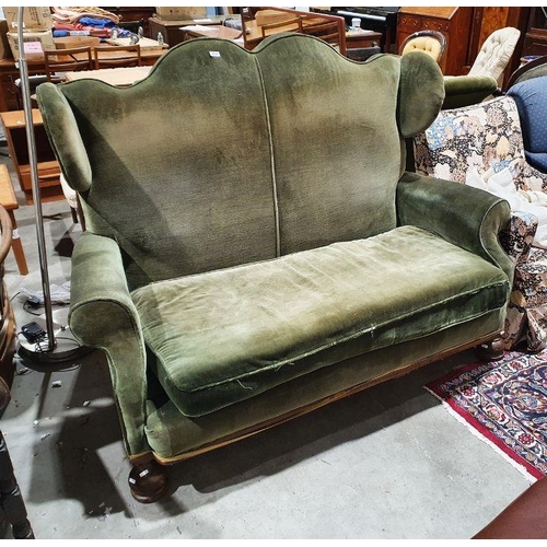 1324 - Late 19th/early 20th century wingback two-seat sofa in green upholstery, on turned front legs