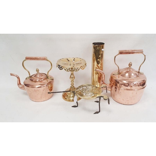 142 - Two copper kettles, a brass trivet with royal cypher, a set of five graduated copper saucepans with ... 