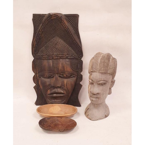 144 - African carved hardwood mask depicting a woman with chip carved headdress, 48cm high, a carved hardw... 