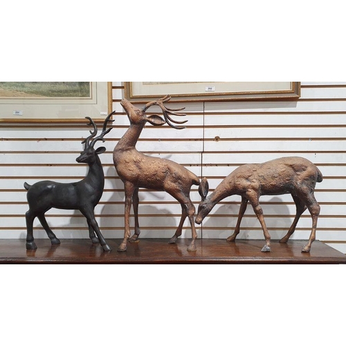 170 - Two copper-effect metal models of deer and another resin model of a deer, tallest 52cm high (3)