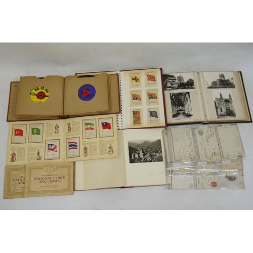 174 - Album and contents of Kensitas cigarette silks depicting flags of the British Empire, a postcard alb... 