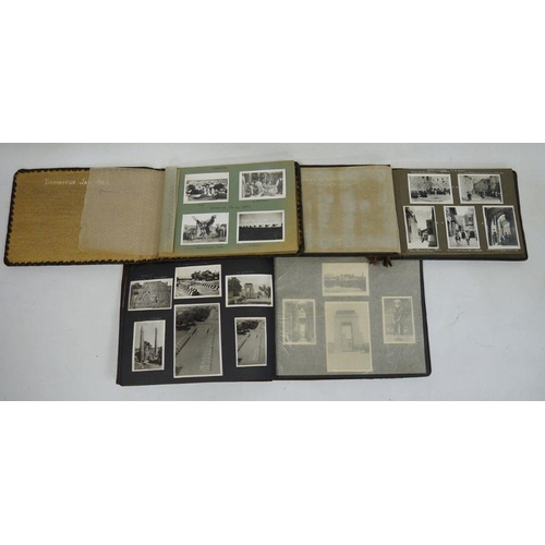 175 - Three World War II photograph albums to include a leather photo album and contents containing photog... 