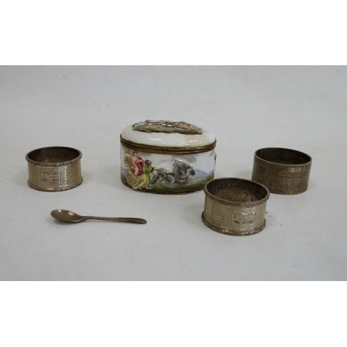 245 - Three silver napkin rings and a porcelain snuff box of oval form, the top of the hinged cover depict... 