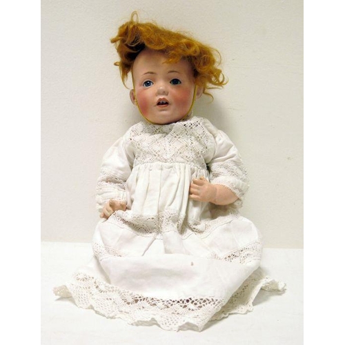 260 - J.D.Kestner '245' bisque head baby doll, marked to back of head, blue eyes, open mouth, 34cm long ap... 