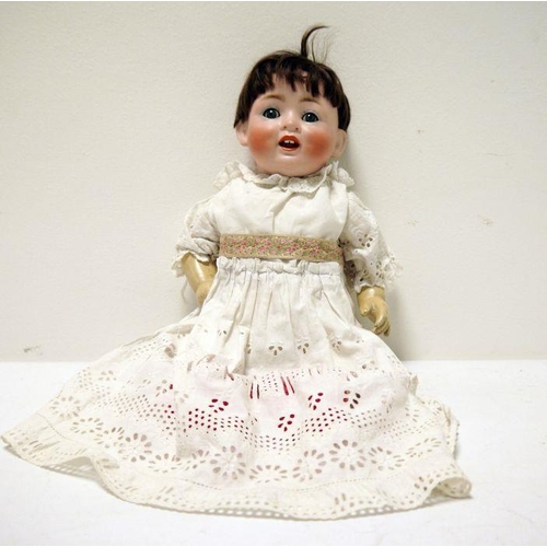 261 - A bisque head baby doll, with composition body, closing eyes and open mouth, marked to back of head ... 