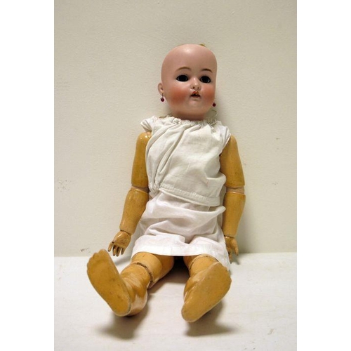 265 - Simon and Halbig/Kammer and Reinhardt bisque headed doll with jointed composition body, pierced ears... 