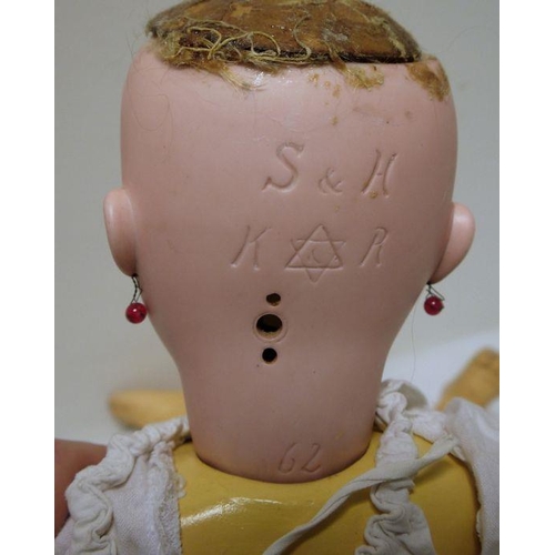 265 - Simon and Halbig/Kammer and Reinhardt bisque headed doll with jointed composition body, pierced ears... 