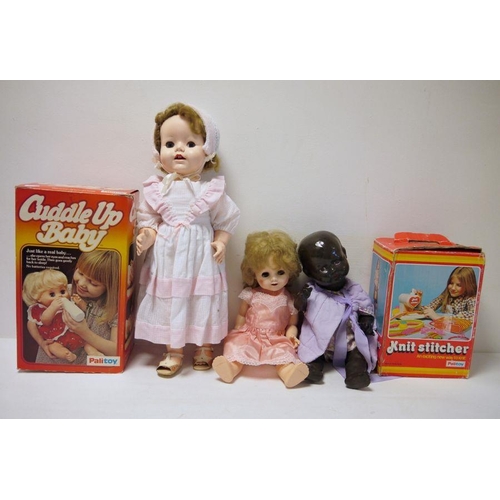 278 - Palitoy 'Cuddle Up Baby' boxed, black doll, assorted dolls, knit stitcher boxed and a large quantity... 