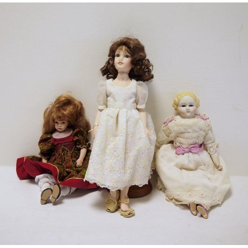 281 - An Ellie's Doll workshop all porcelain doll on stand, a Pauline's limited edition doll 'Demi' no 559... 