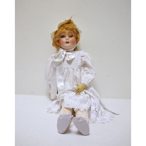 292 - Schoenau & Hoffmeister bisque headed doll with sleeping blue eyes and ball jointed composition body,... 