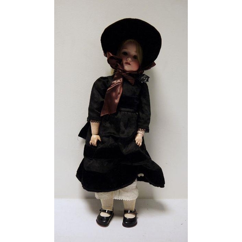 295 - Armand Marseille bisque headed doll, no.390, in black satin and velvet dress, 57cm high