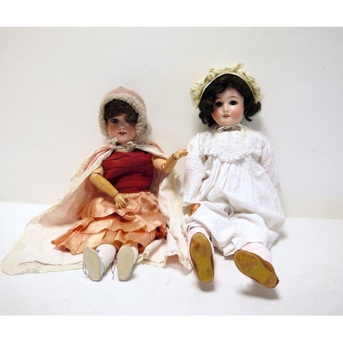 297 - Armand Marseille bisque headed doll no.390, marked 246/1, with blue sleeping eyes, pink dress, 52cm ... 