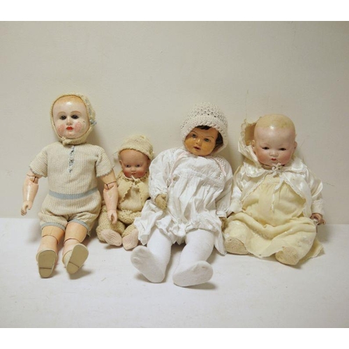 302 - Two composition baby dolls, a bisque headed baby doll with painted features and a composition doll w... 