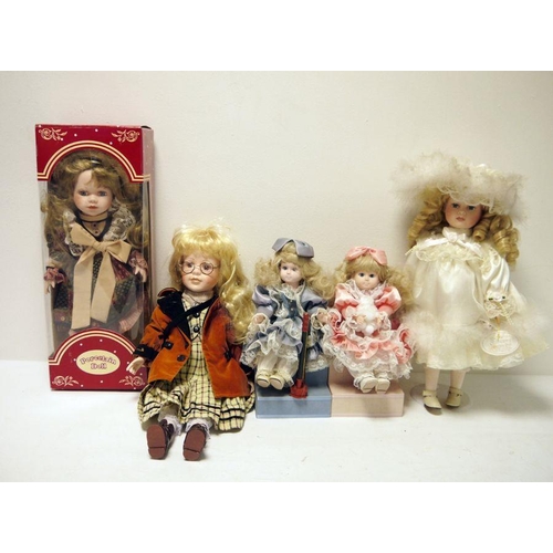 305 - Two boxes of modern porcelain collector's dolls (2)