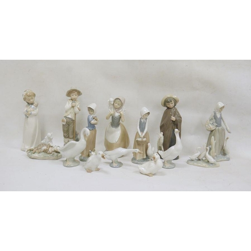 36 - Collection of mainly Nao china figurines, a Lladro group of lamb with cheetah 6926 and a Lladro mode... 