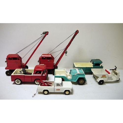 421 - Two Tri-ang tinplate cranes, Tonka truck, jeep and 'Serv-I-Car' and two other trucks (1 box)