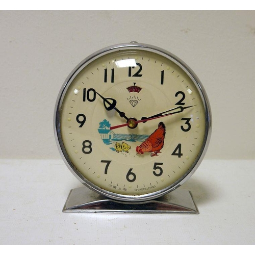 422 - Chrome and green metal keywind clock with animated pecking chicken to the dial, marked 'Shanghai, Ch... 