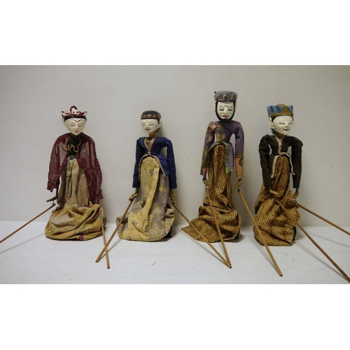 432 - Set of four Eastern painted wood puppet dolls, each on a stand and with arms operated by wooden rods... 