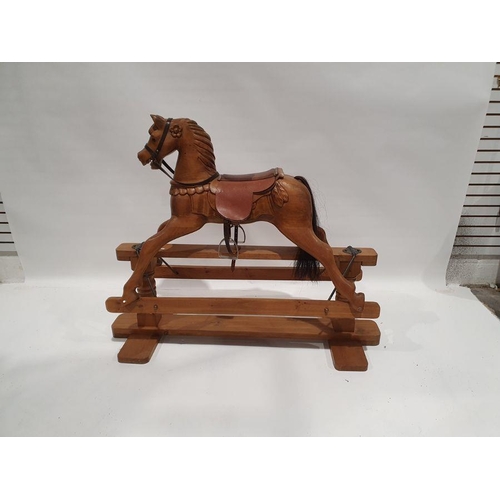 466 - Modern pine platform rocking horse with leather saddle