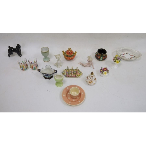 49 - Assorted china and glass wares to include model of poodle, modern Chinese-style koro, thimbles, etc ... 