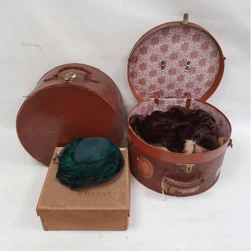 99 - Two vintage leather hat boxes, a quantity of fur stoles and a green feather hat