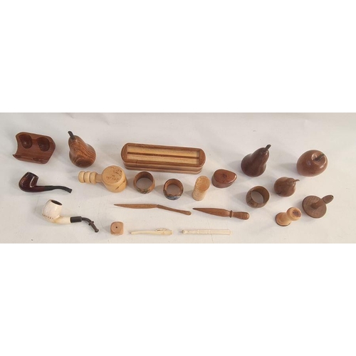 116 - Various items of treen to include carved fruit, eg apples, pears, etc, a pipe, nutcrackers, a pencil... 