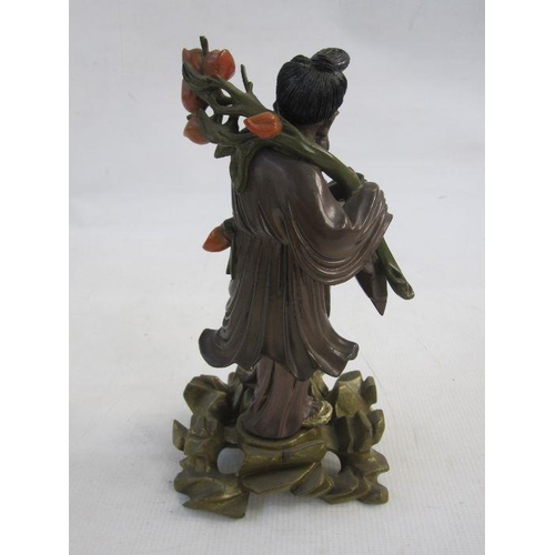 128 - Chinese carved and partly lacquered wood standing figure of a sage holding flowering lotus branch, t... 