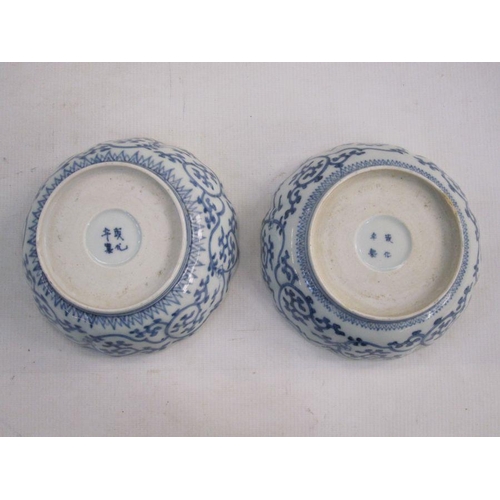 140 - Set of three Chinese porcelain bowls, each slightly lobed and with ogee moulded border, painted in b... 