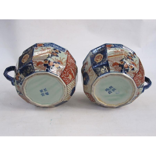 153 - Pair of Japanese imari style chamber pots with typical decoration of landscape and floral panels