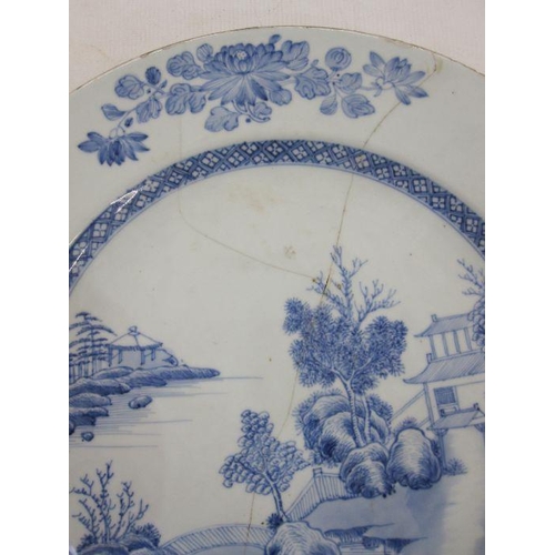 161 - Chinese porcelain plaque, underglaze blue lakeside landscape painted decoration, 36cm diameter (crac... 